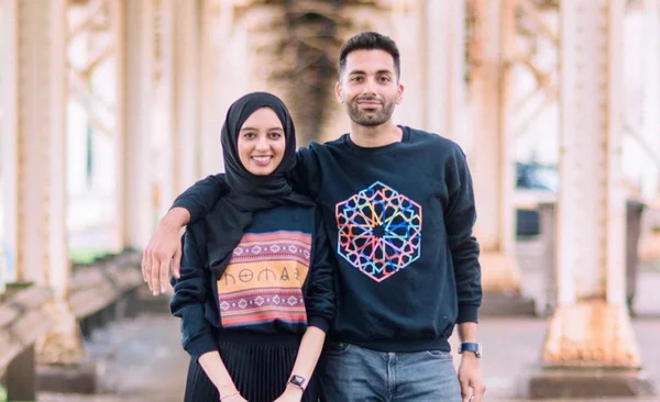 Alaa and Osmaan, Mubdian's founders, wearing Mubdian sweatshirts